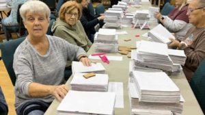 Church event uses 'many hands' to assemble thousands of Bibles for ...