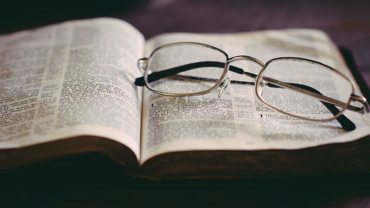 eyeglasses in top of book
