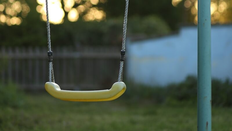 yellow and black swing chair