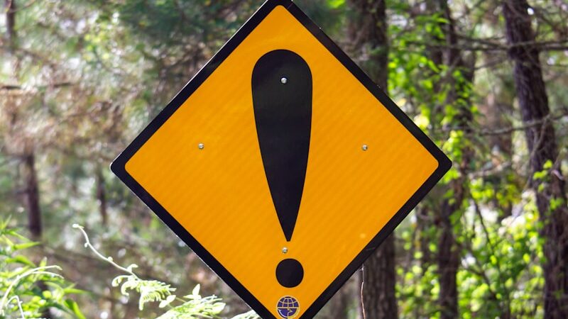 yellow and black road sign