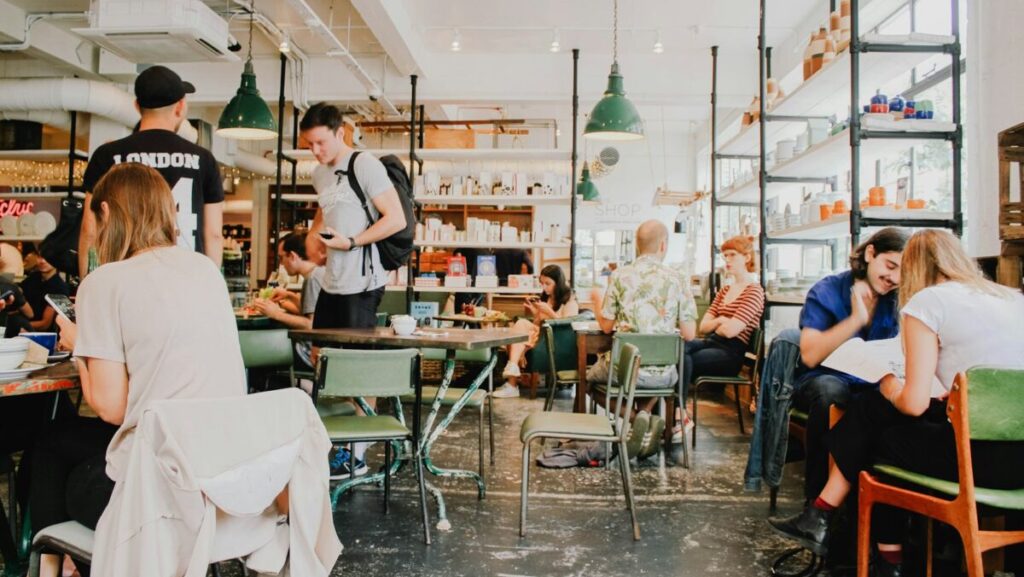 people eating inside of cafeteria during daytime