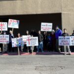 Little Rock church shines gospel light through raising banners for Jesus