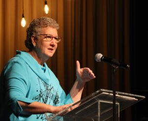 Sandy Wisdom-Martin at podium