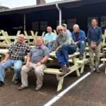‘Willing to serve’: Volunteers spend holidays building new picnic tables for camp