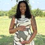 Couple suing surrogate mother who refused abortion gain temporary custody of baby